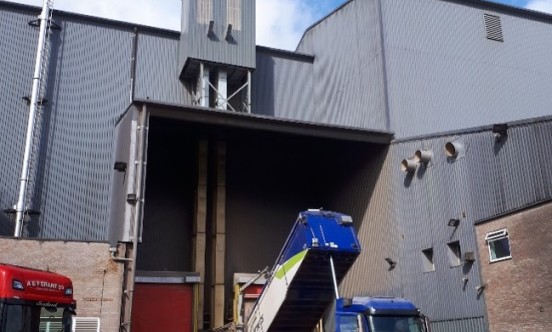 Pigeons accessing grain silo